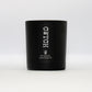 A luxury matt black glass jar, containing a soy scnted candle fragranced with rose and oud